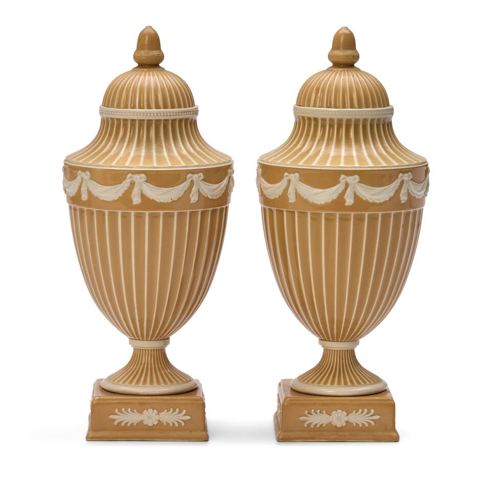 Pair of Wedgwood Cane-colored Slip Decorated Queen's Ware Vases and Covers, England, c. 1900,: Pair of Wedgwood Cane-colored Slip Decorated Queen's Ware Vases and Covers, England, c. 1900, each with acorn finial to a domed cover, vertical striping and central band of raided drapery swags, impre
