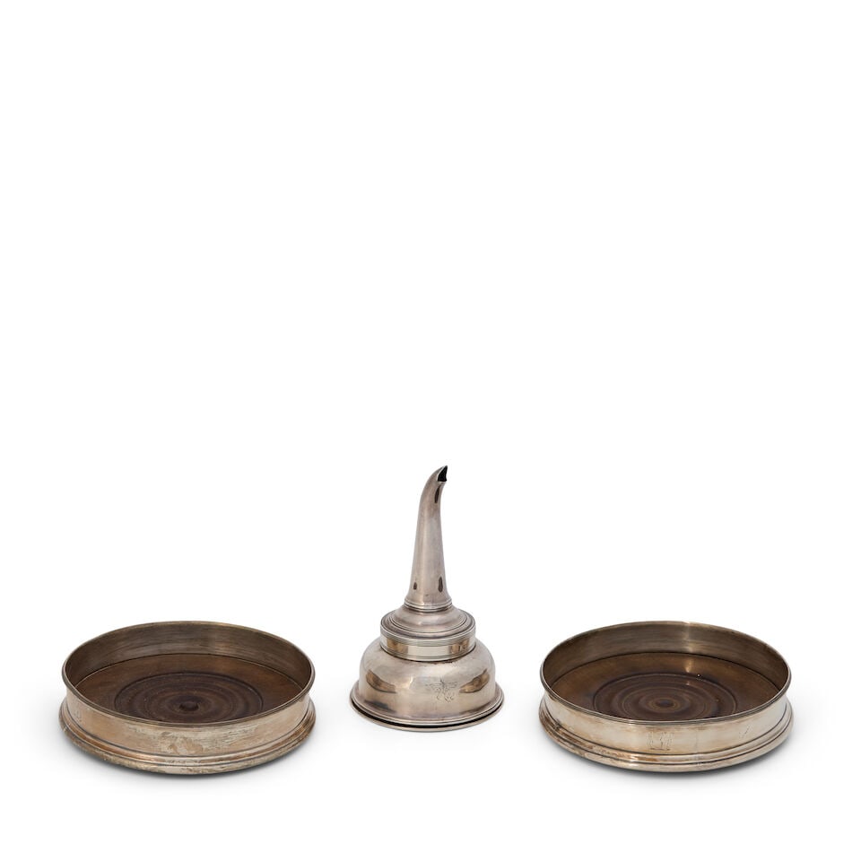 Three Georgian Sterling Silver Wine Items,: Three Georgian Sterling Silver Wine Items, includes a funnel, by Michael Plummer, London, 1793, crested, in three parts, ht. 5; and a pair of coasters, the marks rubbed, cylindrical with a reeded rim 