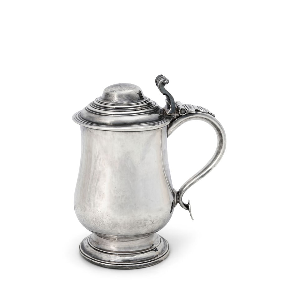 Silver Tankard,: Silver Tankard, late 18th century, stamped MCo separated by a pellet, of standard form, the hinged, stepped lid with scrolled thumbpiece above a baluster-form body, set on a circular spreading foot, w