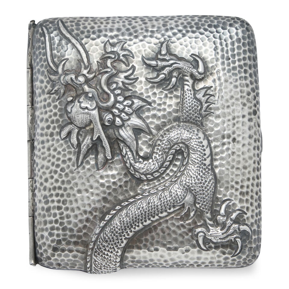 Chinese Export Cigarette Case,: Chinese Export Cigarette Case, early 20th century, apparently unmarked, a flying dragon in repousse extends from cover to back, lg. 3 1/4 in.; approx. 2.65 troy oz. For further information on this lot