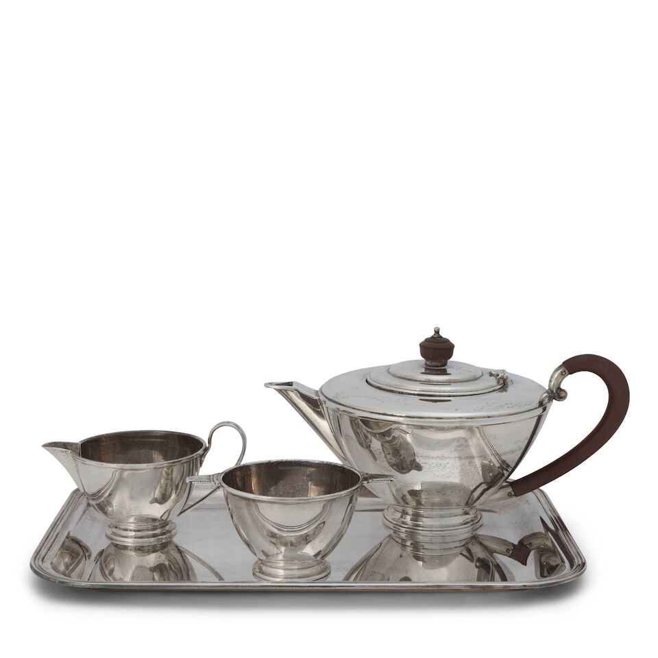 Edwardian Sterling Silver Tea Set and Tray: Edwardian Sterling Silver Tea Set and Tray Birmingham, 1936, Henry Clifford Davis, in the Art Deco style, includes teapot, ht. 6; creamer, ht. 3; sugar bowl, lg. over handles, 5 1/4; together with a C