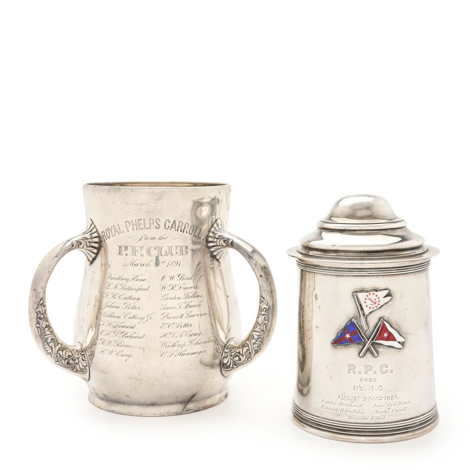 Two Sterling Silver Trophies,: Two Sterling Silver Trophies, one by Howard & Co., New York, 1893, the tankard having a domed lid, the body with three applied enamel flags above the engraving 'R.P.C./ from/ R's.R.C./ August 6th-14th