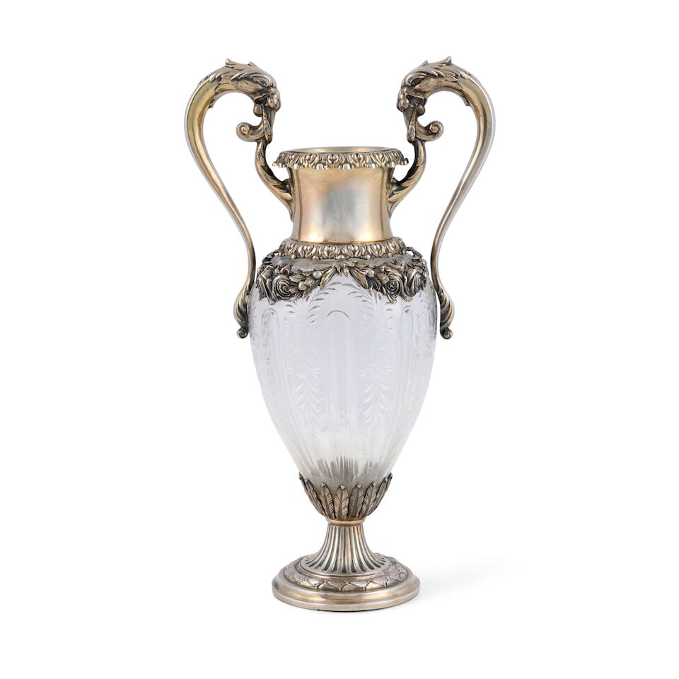 Durgin Sterling Silver and Crystal Vase,: Durgin Sterling Silver and Crystal Vase, Concord, New Hampshire, late 19th century, amphora form, the silver color and floral swag mounted on a cut-crystal body, the scrolled handles with lion head te