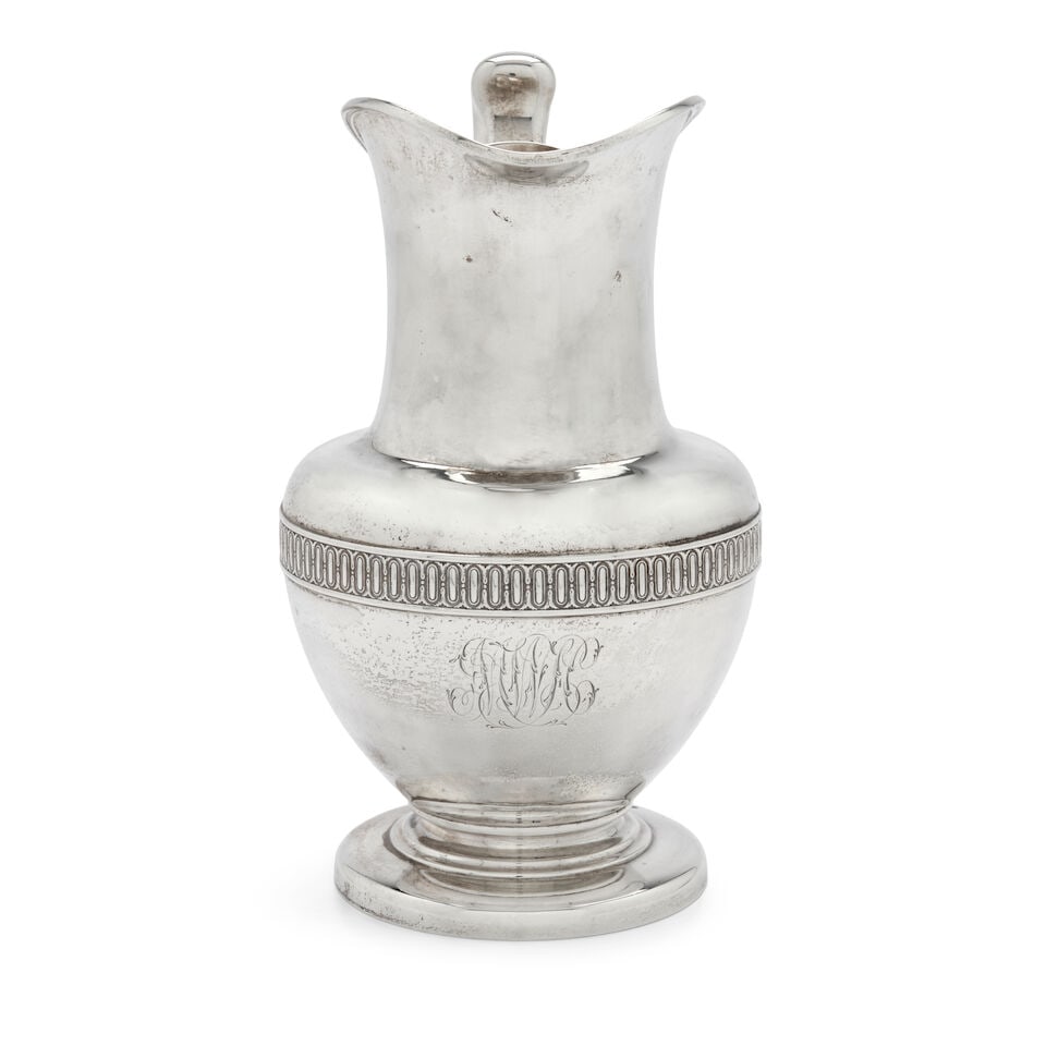 Tiffany & Co. Sterling Silver Water Pitcher,: Tiffany & Co. Sterling Silver Water Pitcher, New York, 1870-1875, monogrammed, having a shaped mouth above a long neck, the globular body with a die-rolled band, set on a circular spreading foot, ht. 