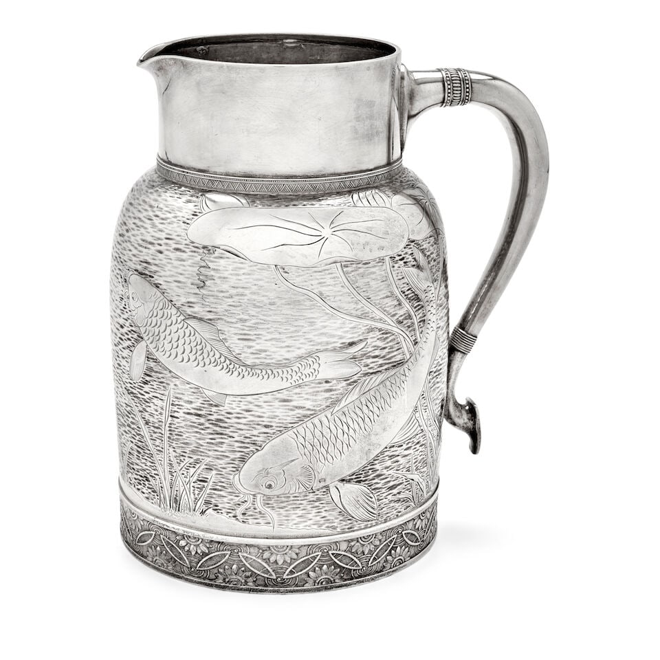 A Tiffany & Co. Sterling Silver Japonesque Water Jug,: A Tiffany & Co. Sterling Silver Japonesque Water Jug, New York, 1870s, the spot-hammered surface creating a rippling water effect, complete with koi fish and lily pads, the underside engraved 'Margare
