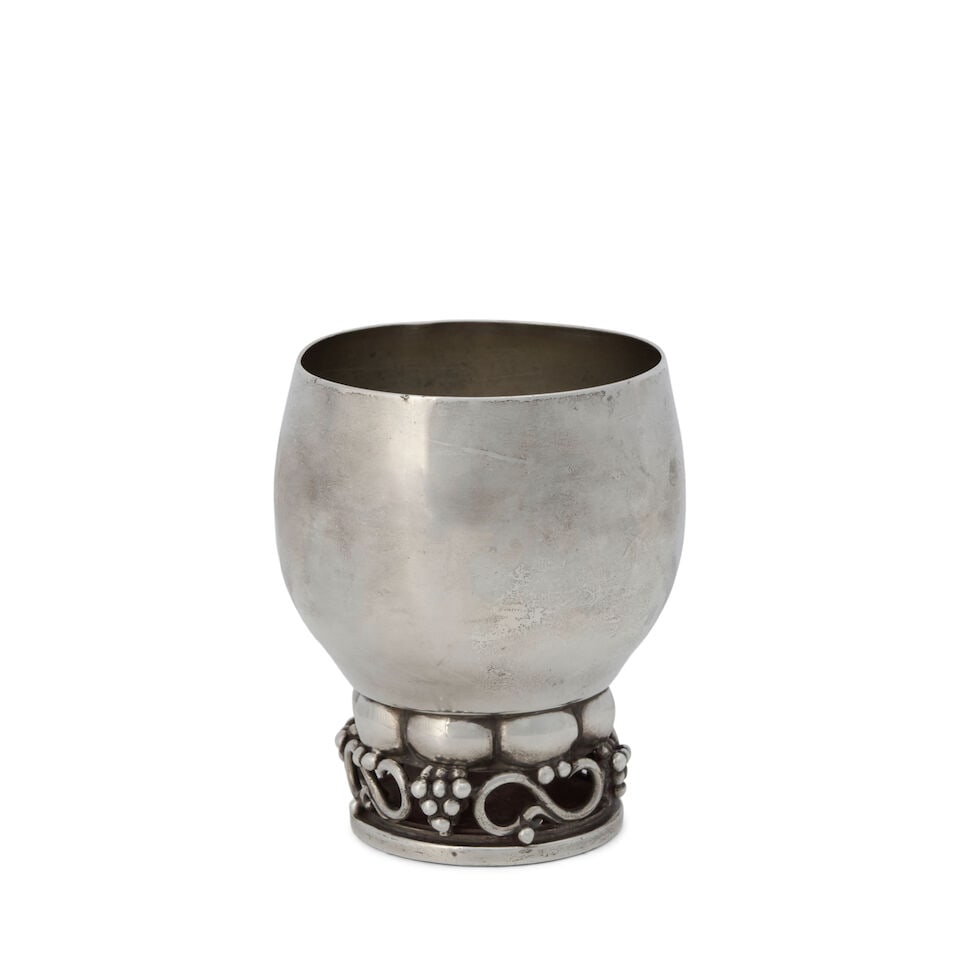 Georg Jensen Sterling Silver Bowl 197B,: Georg Jensen Sterling Silver Bowl 197B, Denmark, 1925-1932, the hand hammered bowl with a lip flared lip raised on berry and leaf supports, on a circular, domed base, ht. 4 1/2, dia. 6 in., approx.