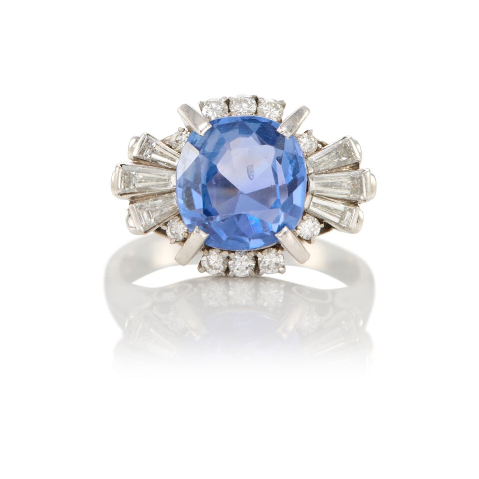 PLATINUM, SAPPHIRE, AND DIAMOND RING WITH GIA REPORT: PLATINUM, SAPPHIRE, AND DIAMOND RING WITH GIA REPORT • Platinum • One modified brilliant cut sapphire stated to weigh 3.30 carats • Seven round shaped diamonds weighing approximately