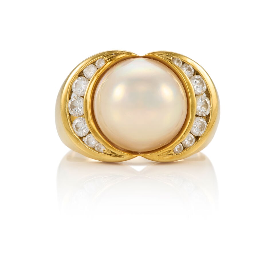 18K GOLD, CULTURED PEARL, AND DIAMOND RING: 18K GOLD, CULTURED PEARL, AND DIAMOND RING • 18K yellow gold • One cultured pearl measuring approximately 12.20mm in diameter • Numerous round shaped diamonds weighing approximately