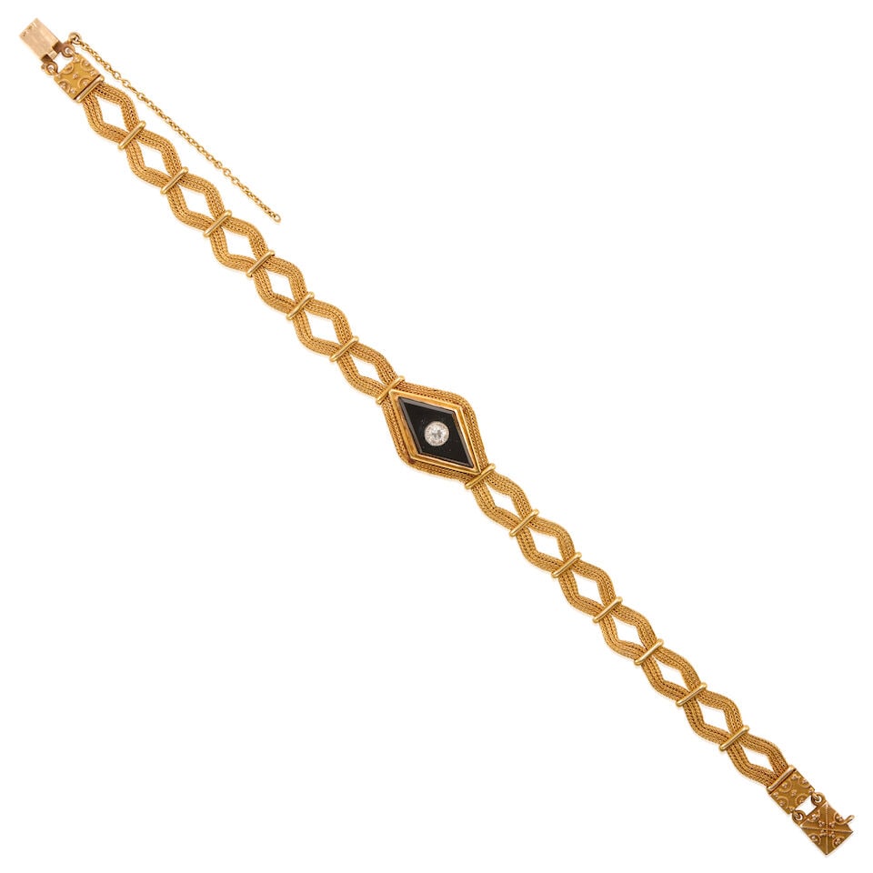GOLD, ONYX, AND DIAMOND BRACELET: GOLD, ONYX, AND DIAMOND BRACELET • 14K yellow gold • One drilled diamond-shaped onyx measuring 17.86mm x 9.30mm • One round shaped diamond weighing approximately 0.15 carat