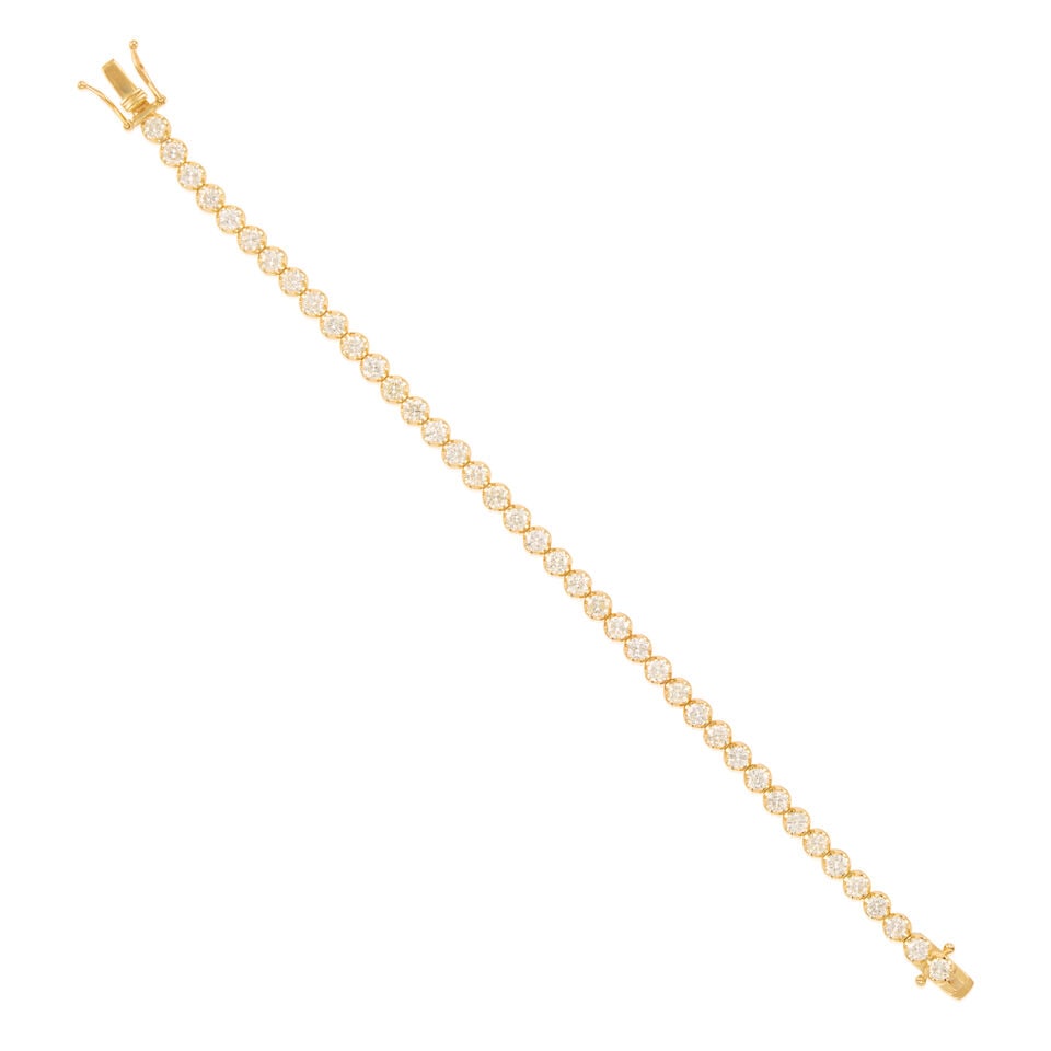 14K GOLD AND DIAMOND BRACELET: 14K GOLD AND DIAMOND BRACELET • 14K yellow gold • Numerous round shaped diamonds weighing approximately 5.20 carats total • Length 7 in. • Estimated gross weight: 10.3 grams Fo