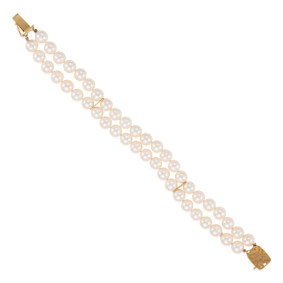 MIKIMOTO: 18K GOLD AND CULTURED PEARL BRACELET: MIKIMOTO: 18K GOLD AND CULTURED PEARL BRACELET • 18k yellow gold • Numerous cultured pearls measuring approximately 7.30mm in diameter • One cultured pearl on clasp measuring