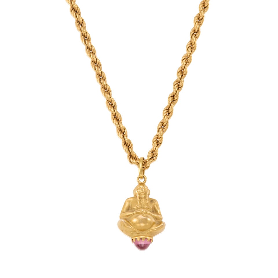 18K GOLD PENDANT NECKLACE: 18K GOLD PENDANT NECKLACE • 18k yellow gold • 1 round cabochon pink stone measuring approximately 7.77mm in diameter • Length 28 1/4, pendant measures 1 1/4 x 1 in. •