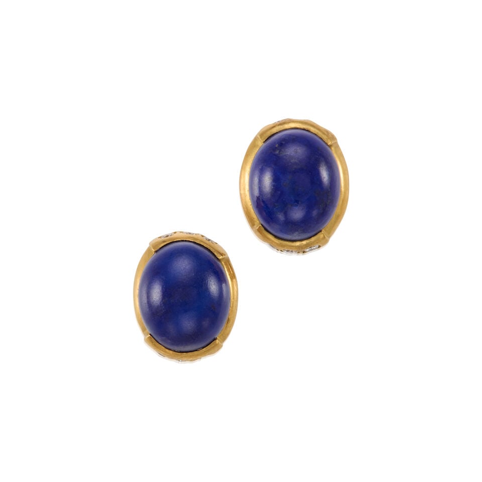 18K GOLD, LAPIS LAZULI, AND DIAMOND EARRINGS: 18K GOLD, LAPIS LAZULI, AND DIAMOND EARRINGS • 18K yellow gold • Two cabochon lapis lazuli measuring approximately 12.66mm x 11.18mm x 5.16mm • Numerous round shaped diamonds