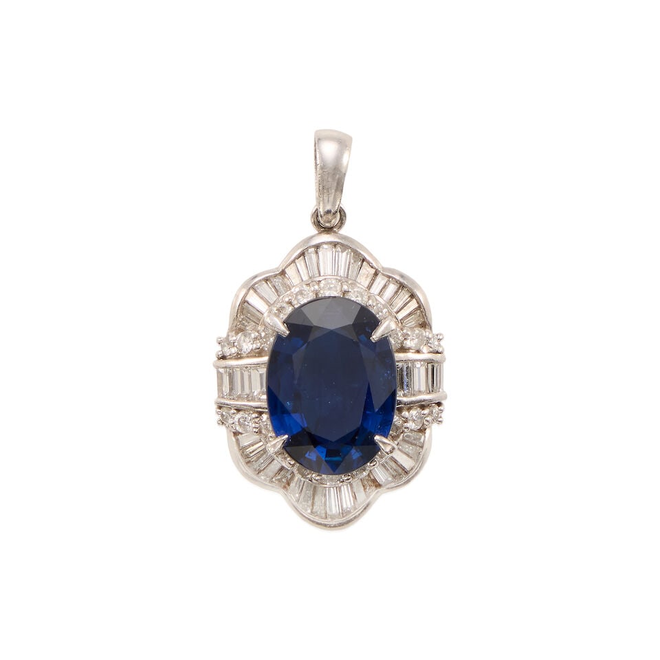 PLATINUM, SAPPHIRE, AND DIAMOND PENDANT: PLATINUM, SAPPHIRE, AND DIAMOND PENDANT • Platinum • One oval shaped sapphire weighing approximately 2.50 carats total • Numerous round shaped diamonds weighing approximately 0.20