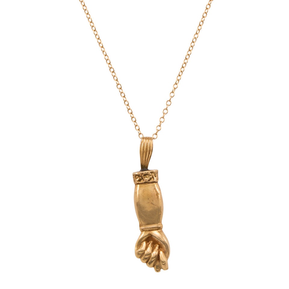 12K GOLD FIGA PENDNT NECKLACE: 12K GOLD FIGA PENDNT NECKLACE • 12K yellow gold • Gold Figa pendant measures 1 3/4 in. x 1/2 in. • Chain length 20 in. • Estimated gross weight: 17.1 grams Footnotes: Overall