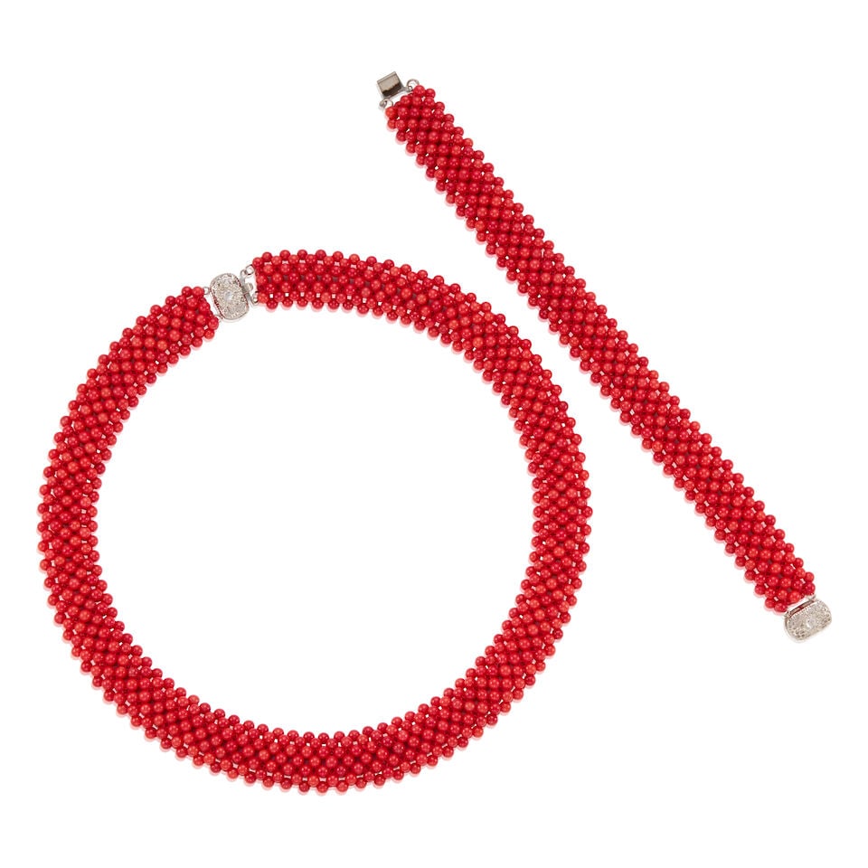 CORAL BEAD SET: CORAL BEAD SET • Base metal • Numerous coral beads measuring approximately 3.75mm in diameter • Two colorless round stones • Length of bracelet 8 in., length of necklace 18