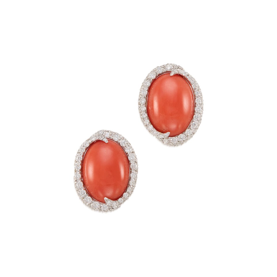 GOLD, CORAL, AND DIAMOND EARRINGS: GOLD, CORAL, AND DIAMOND EARRINGS • 14K and 16K white gold • Two carved coral pieces measuring approximately 15.90mm x 12.30mm x 4.98mm • Numerous round shaped diamonds weighing