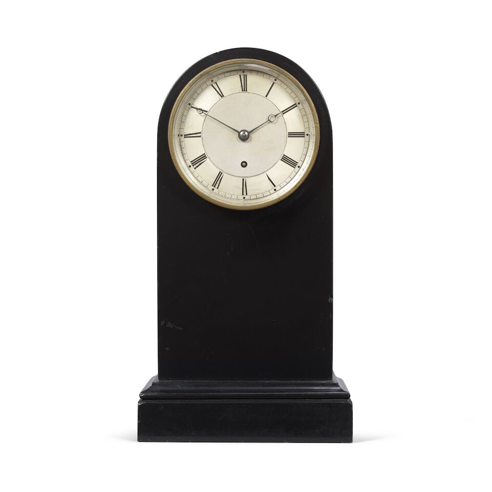 A mid 19th century black marble mantel timepiece Budgen, Croydon: A mid 19th century black marble mantel timepiece Budgen, Croydon The black marble case with moulded base, with 4 inch engine turned silvered dial with blued steel hands the single fusee movement with