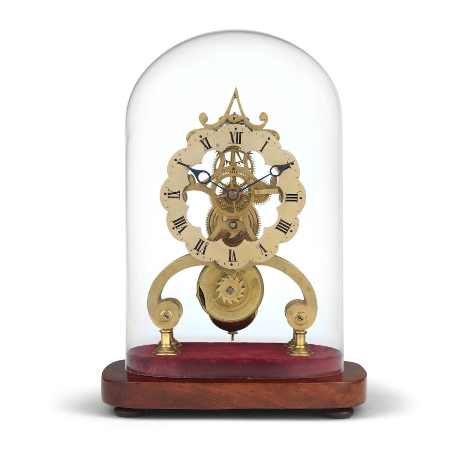 A skeleton clock timepiece in glass dome and mahogany base: A skeleton clock timepiece in glass dome and mahogany base The clock set within a later glass dome on a mahogany base. The 5 inch chapter ring with black Roman numerals and blued steel hands. The move