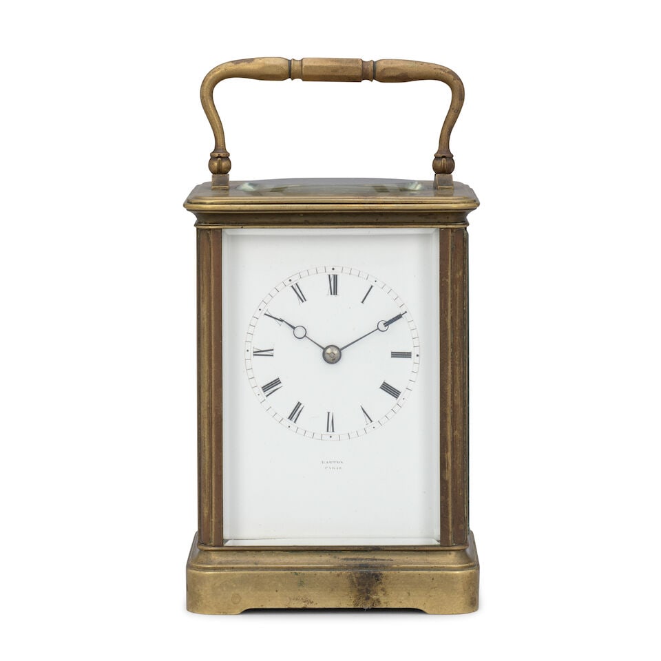 A late 19th century French carriage clock timepiece Japy Freres, retailed by Batton, Paris: A late 19th century French carriage clock timepiece Japy Freres, retailed by Batton, Paris The case surmounted by a brass carrying handle over an oval observation window, with further glazed panels