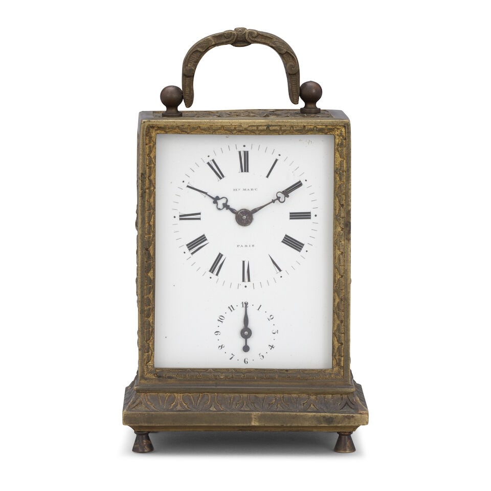 An unusual mid 19th century French carriage clock with tic-tac escapement Henry Marc, Paris: An unusual mid 19th century French carriage clock with tic-tac escapement Henry Marc, Paris The decorated case surmounted by a fancy carrying handle over a decorated top and sides terminating in a