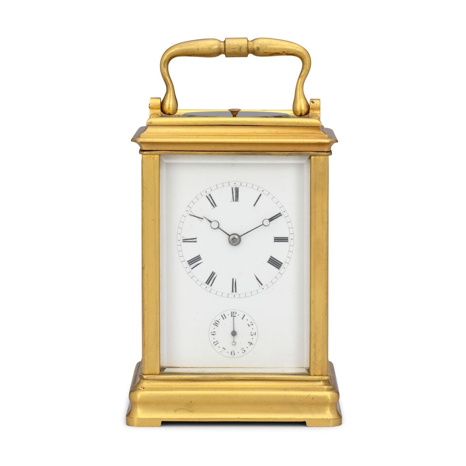 A late 19th century striking and repeating gorge cased carriage clock Japy Frères: A late 19th century striking and repeating gorge cased carriage clock Japy Frères The case surmounted by a brass carrying handle over an oval observation window with repeat button, the arched top
