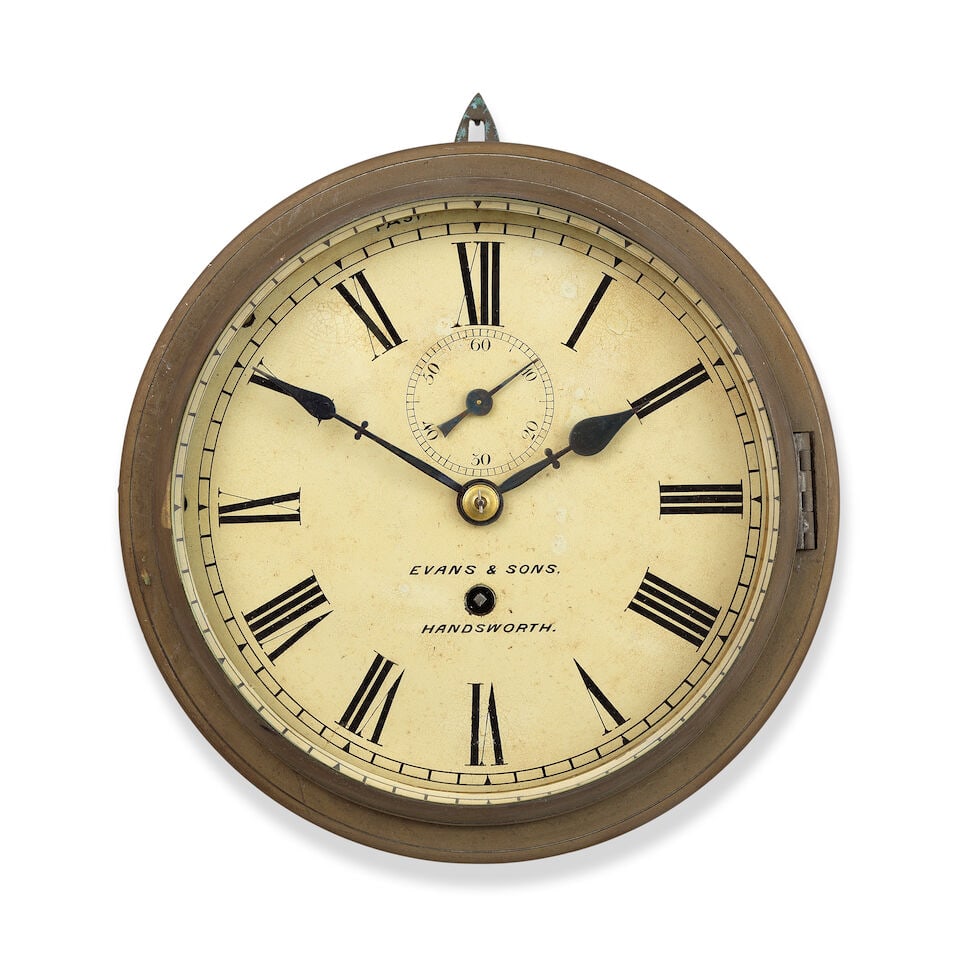 A late 19th century brass bulkhead timepiece ships clock Evans & Sons, Handsworth Birmingham: A late 19th century brass bulkhead timepiece ships clock Evans & Sons, Handsworth Birmingham The simple brass case with painted black surround with cast brass bezel and bevelled glass. The 8 inch