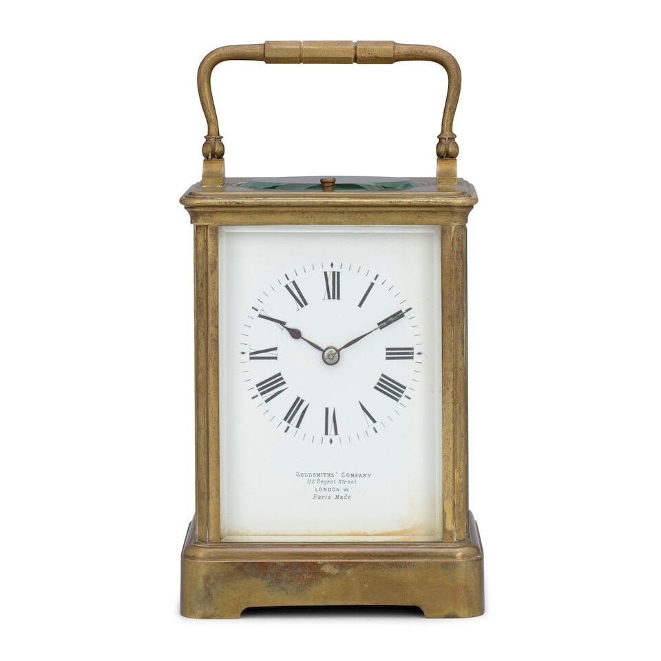 A late 19th century French striking and repeating carriage clock Goldsmith Company, 112 Regent ...: A late 19th century French striking and repeating carriage clock Goldsmith Company, 112 Regent Street London W, Paris Made The case surmounted by a brass carrying handle over an oval observation windo