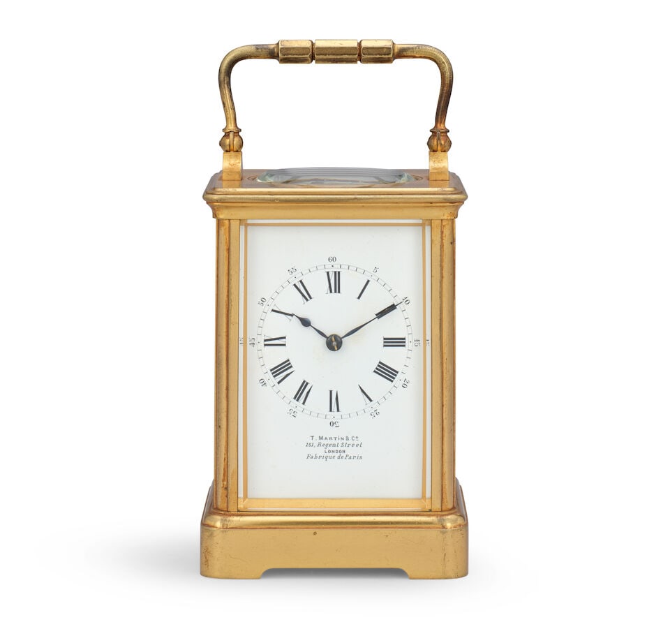 A late 19th century French carriage clock timepiece Drocourt retailed by T. Martin & Co., 151 R...: A late 19th century French carriage clock timepiece Drocourt retailed by T. Martin & Co., 151 Regent Street, London, Fabrique de Paris The case sumounted by a brass carrying handle over an oval