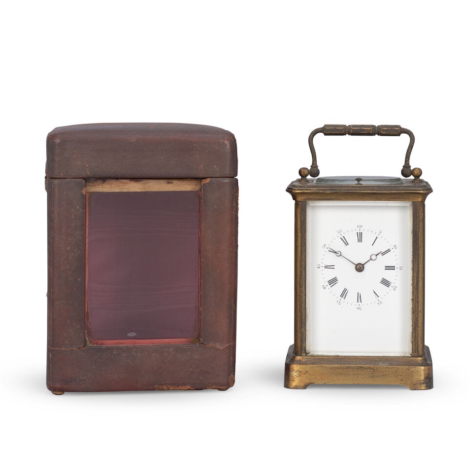 A late 19th century French striking and repeating carriage clock with original travel case A.B. ...: A late 19th century French striking and repeating carriage clock with original travel case A.B. Paris No.103 The case surmounted by a brass carrying handle over an oval observation window and repeat b