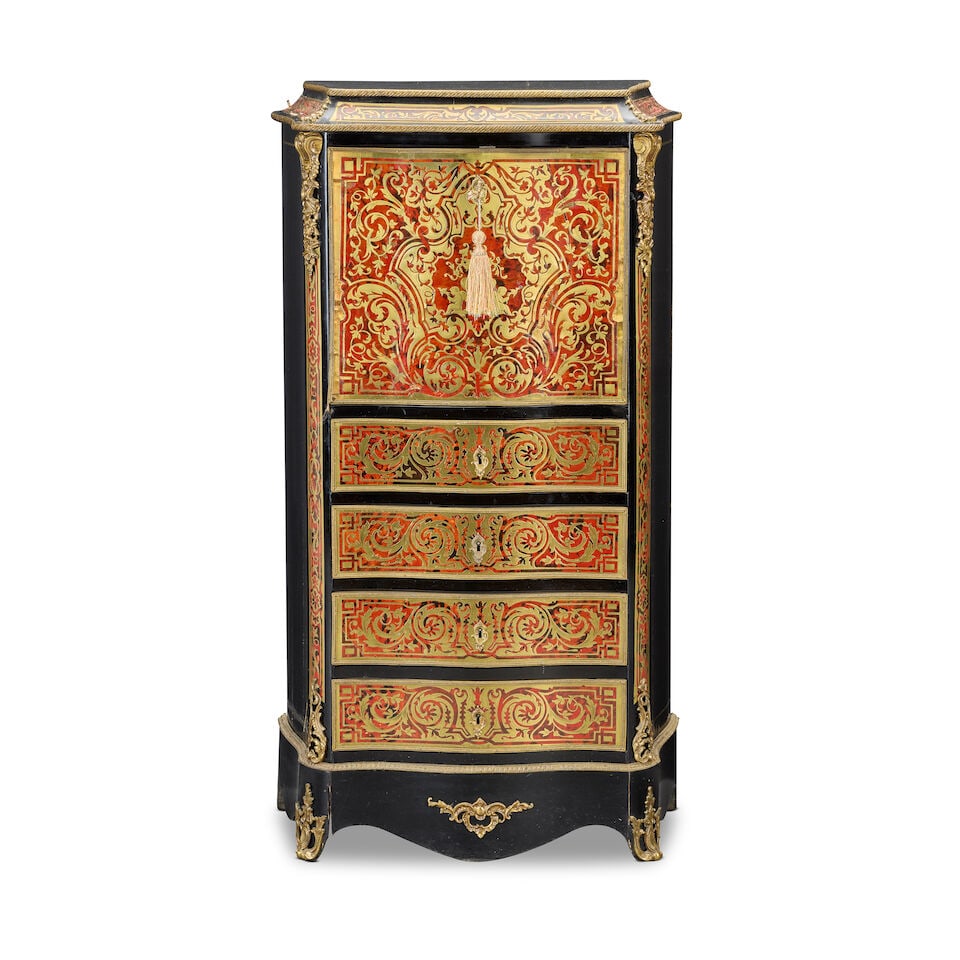 A French early 20th century ebonised, gilt metal mounted, red stained tortoiseshell and cut bras...: A French early 20th century ebonised, gilt metal mounted, red stained tortoiseshell and cut brass inlaid 'Boulle' serpentine secrétaire à abattant The fall enclosing a fitted birds eye maple