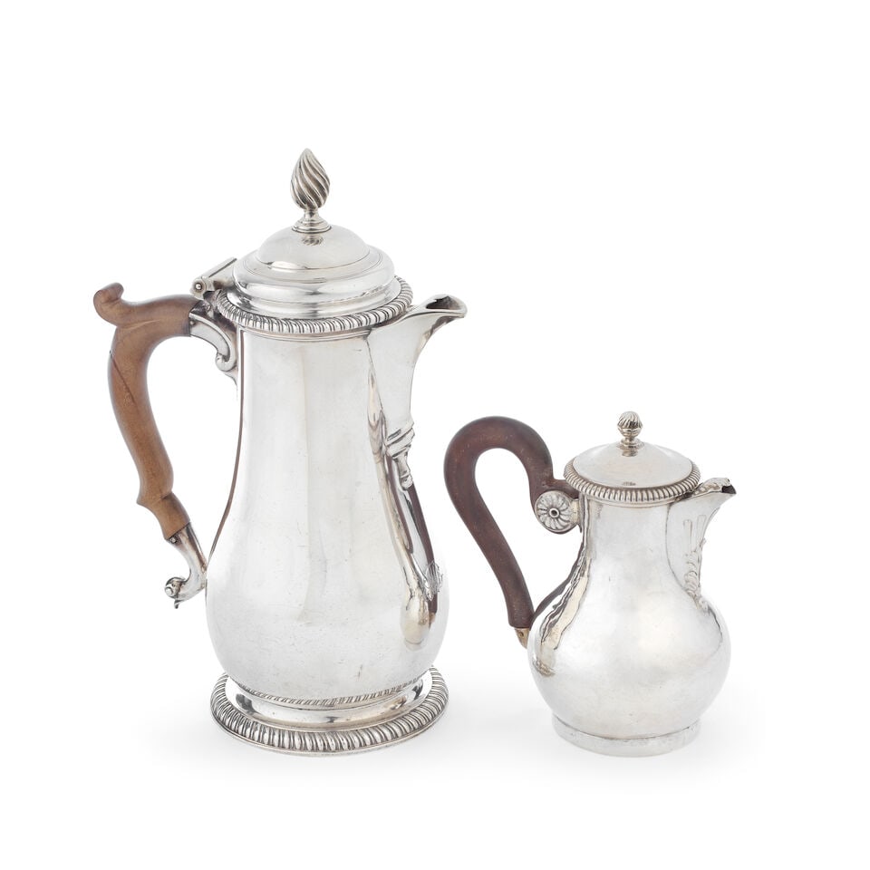 A George II silver hot water jug and a French silver-gilt coffee pot Thomas Cooke II & Richard G...: A George II silver hot water jug and a French silver-gilt coffee pot Thomas Cooke II & Richard Gurney, London 1756 and François-Julien Doyen, Paris 1852-1870 Of baluster form, with hinged stepped
