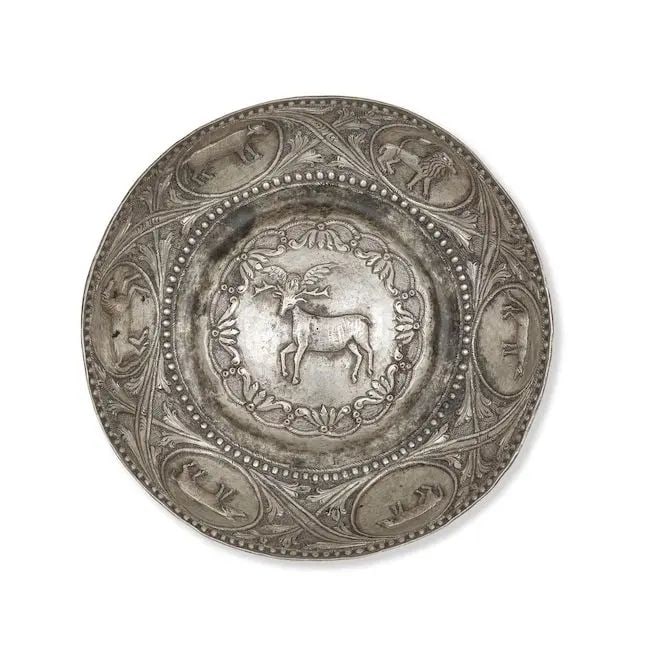 An Ottoman silver bowl (tas) Balkans, 18th Century: An Ottoman silver bowl (tas) Balkans, 18th Century of rounded form with domed centre, decorated in repoussé with deer and owl to centre with floriated border, roundels with quadrupeds to walls su