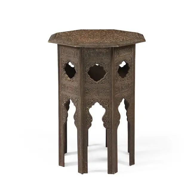 A Nasrid style bronze table Europe, 19th Century: A Nasrid style bronze table Europe, 19th Century of octagonal form, cast with radiating palmettes around two eight-pointed stars, the sides with foliate motifs with openwork niches and lobed cartouche