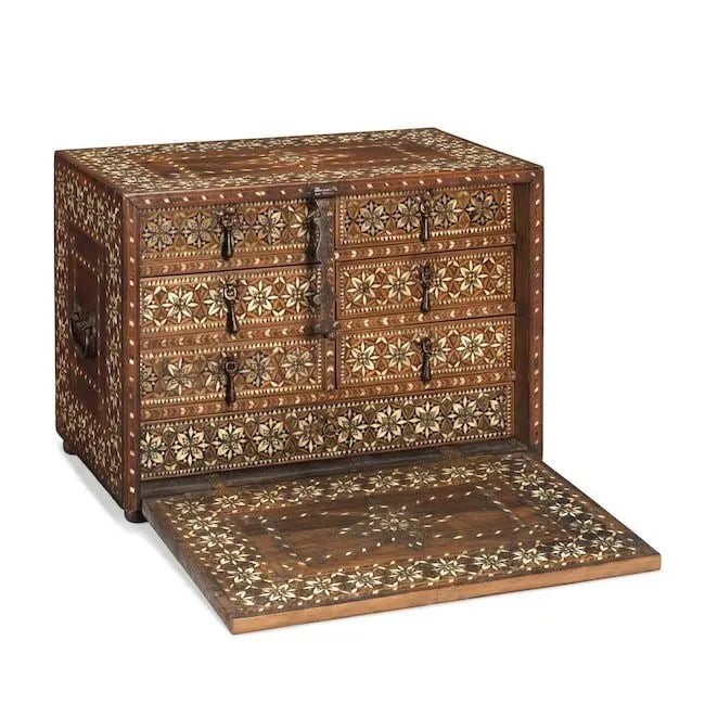 A post-Nasrid silver- and bone-inlaid taracea cabinet Spain, 16th Century: A post-Nasrid silver- and bone-inlaid taracea cabinet Spain, 16th Century of rectangular form with hinged fall front opening to reveal seven drawers within, profusely inlaid and decorated with silver 