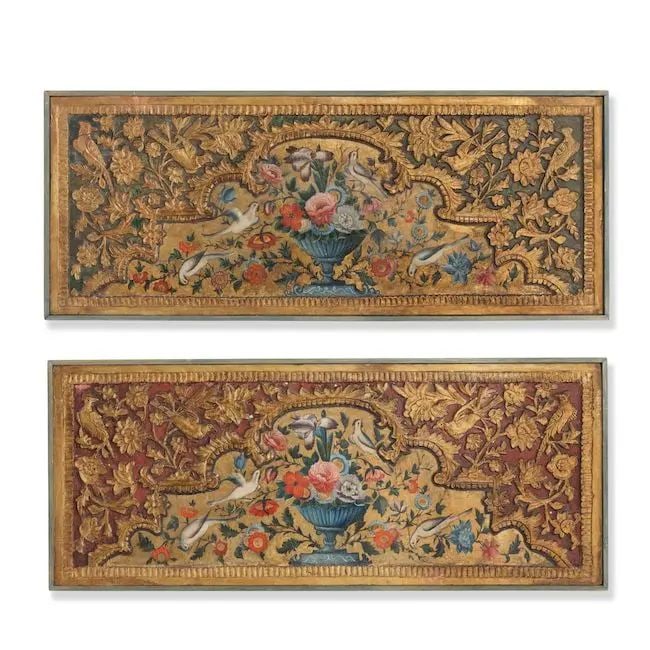 A pair of Qajar painted and gessoed wood panels Persia, 19th Century(2): A pair of Qajar painted and gessoed wood panels Persia, 19th Century each of rectangular form, carved and painted in polychrome and gold with a cusped arch containing a floral spray issuing from an ur