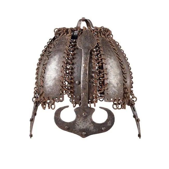 A rare mail and plate helmet Deccan, 16th/ 17th Century: A rare mail and plate helmet Deccan, 16th/ 17th Century comprising ten panels linked to each other with mail rings, surmounted by a circular crest with cruciform applied loops to top, earflap to each 