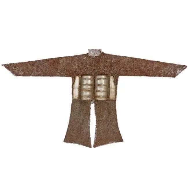 A chainmail and plate steel shirt from the Bikaner Armoury Deccan, 16th/ 17th Century: A chainmail and plate steel shirt from the Bikaner Armoury Deccan, 16th/ 17th Century the thigh-length shirt with long sleeves and composed of riveted links, the front with four rectangular plates eac