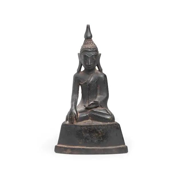 A bronze figure of seated Buddha Burma, 18th Century: A bronze figure of seated Buddha Burma, 18th Century wearing monastic robes and seated on a plain lotus pedestal, touching the earth with his right hand to bear witness to his victory over Mara at the