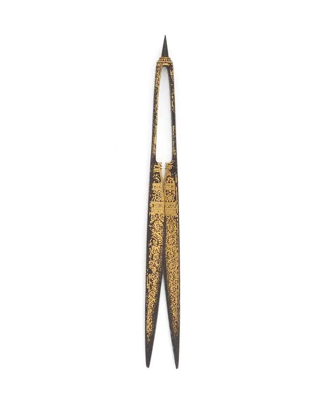 A pair of gold-inlaid steel scissors (takrai) Thailand, 18th Century: A pair of gold-inlaid steel scissors (takrai) Thailand, 18th Century the blades of foliate form, the ends of the handle terminating in a pointed finial, decorated in gold inlay with swirling floral an