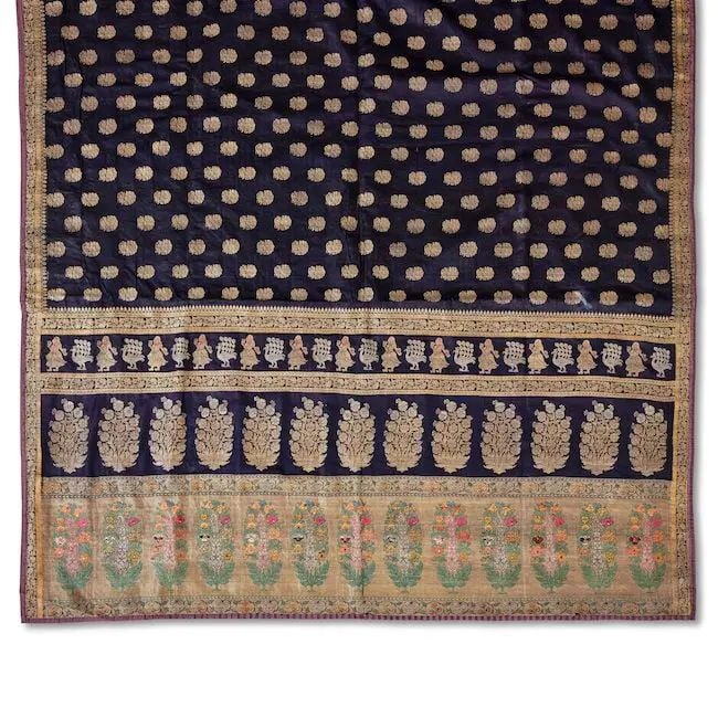 A silk and metal thread embroidered sari (kimkhwab) North India, 18th/ 19th Century: A silk and metal thread embroidered sari (kimkhwab) North India, 18th/ 19th Century of rectangular form, woven on a blue ground in polychrome silks and gilt silver thread, with a repeat design of flor