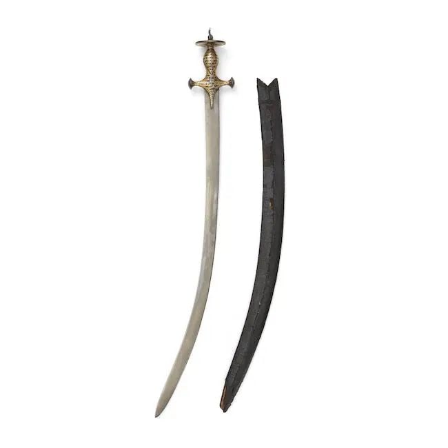 A gold koftgari hilted steel sword (tulwar) with bubri decoration India, 19th Century (1 of 1)