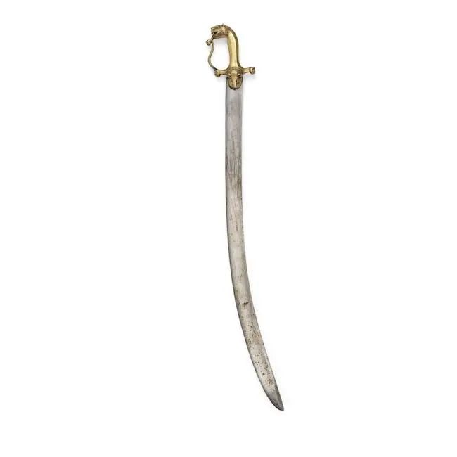 A brass hilted steel sword from the armoury of Tipu Sultan Mysore, Seringapatam, late 18th Century: A brass hilted steel sword from the armoury of Tipu Sultan Mysore, Seringapatam, late 18th Century the single-edged English blade of curved form with central fuller and armour piercing tip, the hilt o