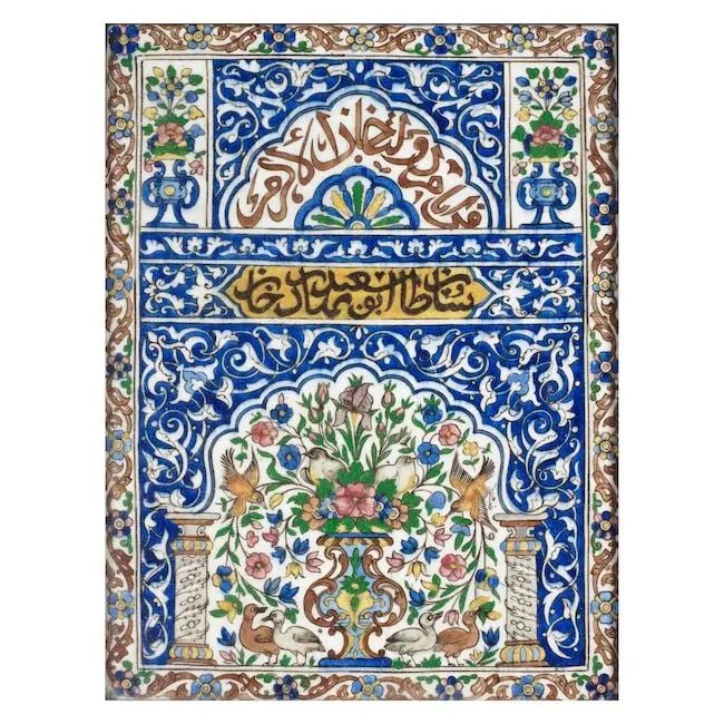 A Qajar underglaze-painted pottery tile bearing the name of Sultan Abu Sa'id Bahadur Khan Persia...: A Qajar underglaze-painted pottery tile bearing the name of Sultan Abu Sa'id Bahadur Khan Persia, 19th Century of rectangular form, decorated in polychrome on a white ground with an architectural comp