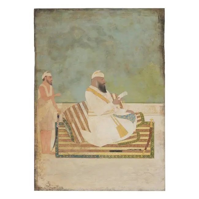 A Sikh nobleman seated on a terrace reading a letter, with an armed attendant standing behind hi...: A Sikh nobleman seated on a terrace reading a letter, with an armed attendant standing behind him Punjab, early 19th Century gouache and gold on paper, inscribed in Persian in nasta'liq verso 223 x 16