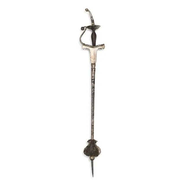 A gilt-silver overlaid steel mace (gurz) Punjab, 18th/ 19th Century: A gilt-silver overlaid steel mace (gurz) Punjab, 18th/ 19th Century the haft fluted, the basket hilt with foliate and floral motifs and lobed quillons, the pommel of typical tulwar form, the knuckle g