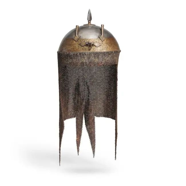 A gold koftgari steel helmet (khula khud) Lahore, early 19th Century: A gold koftgari steel helmet (khula khud) Lahore, early 19th Century of domed form with spiked finial, two plume holders and noseguard bracket, decorated in gold overlay with bands of floral and folia