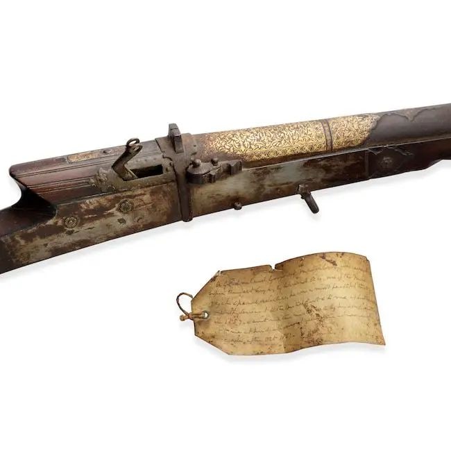 A gold koftgari steel matchlock gun (torador) belonging to Ahmad Ali, a 'Special Orderly' of Mah...: A gold koftgari steel matchlock gun (torador) belonging to Ahmad Ali, a 'Special Orderly' of Maharajah Ranjit Singh (reg. 1801-1839) North India, 19th Century of typical form, the barrel terminating i
