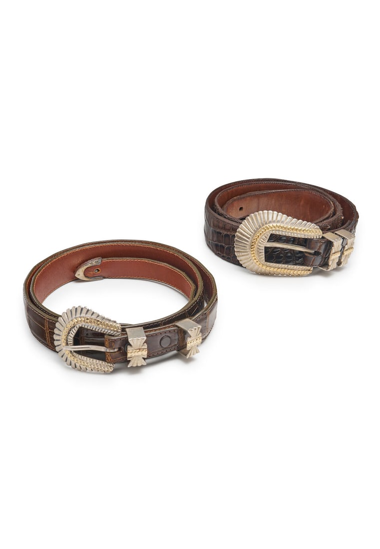 James Reid | two sterling silver and gold belts: James Reid | two sterling silver and gold belts each designed as a Native American headdress with gold accents, on alligator and crocodile leather belts, signed JR ltd S.Fe, 925 18K, lengths 114.0
