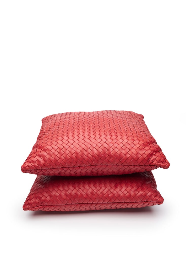 Bottega Veneta | Intrecciato leather cushions: Bottega Veneta | Intrecciato leather cushions in fine burgundy leather with tags attached each stamped BOTTEGA VENETA, 38.0 x 38.0cm (14 15/16 x 14 15/16in). For further information on this lot please